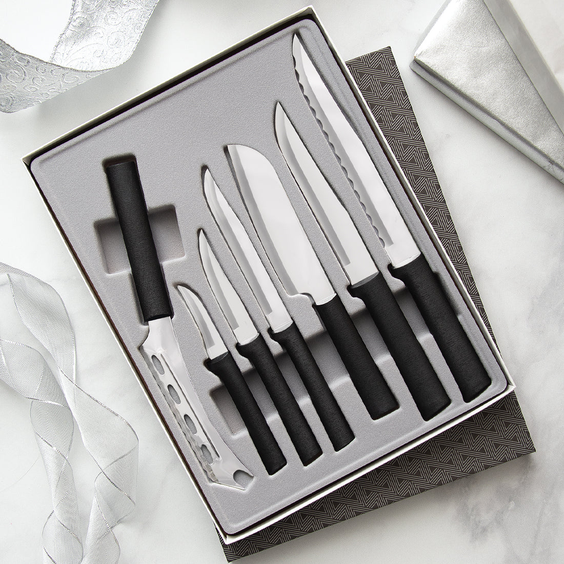 Black handled Starter Gift Set (Part 2) in a gift box on a white background with silver table decorations.