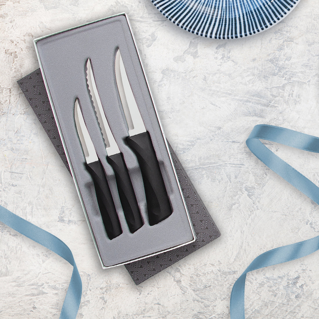 An Anthem Wave Slice &amp; Pare Set on a gray background with blue ribbons
