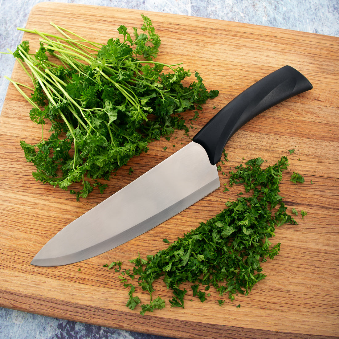 Chopping a bunch of fresh parsley with the Rada Cutlery Anthem Wave French Chef knife. 