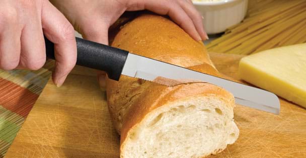 https://products.radacutlery.com/cdn/shop/products/bread-knife-slicing_1200x.jpg?v=1687977403