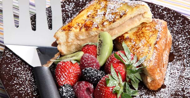 The black handled turnover on a plate with stuffed