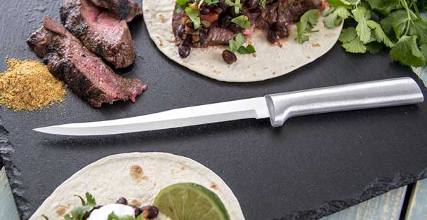 https://products.radacutlery.com/cdn/shop/products/carver-knife-steak-fajitas_1200x.jpg?v=1687979167