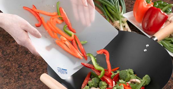 https://products.radacutlery.com/cdn/shop/products/cutting-board-with-vegetables_1200x.jpg?v=1687979446
