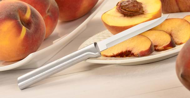 Regular aluminum handled Paring Knife on a plate o