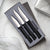 A Paring Knives Galore Gift Set on a marble background.