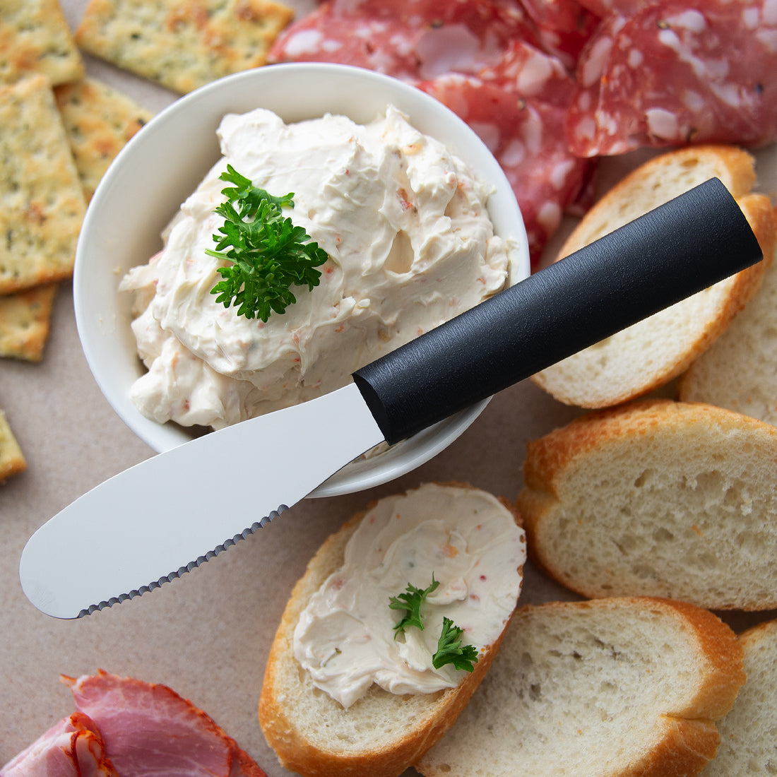 A Party Spreader on a cutting board with slices of bread