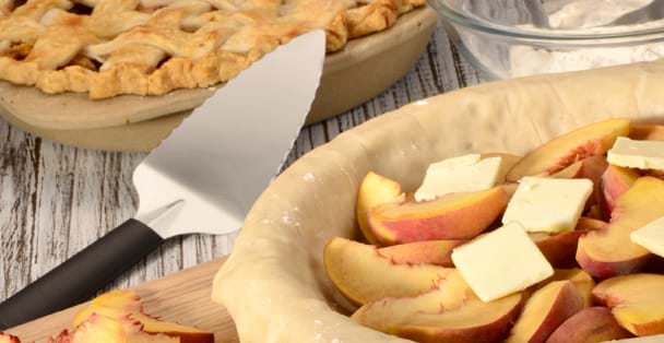 The black handled Pie Server laying by an unbaked