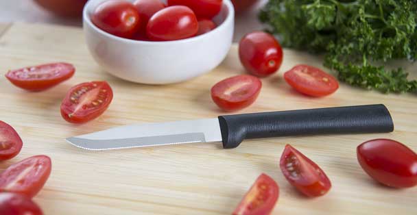 https://products.radacutlery.com/cdn/shop/products/serrated-paring-knife-tomatoes_1200x.jpg?v=1687977714