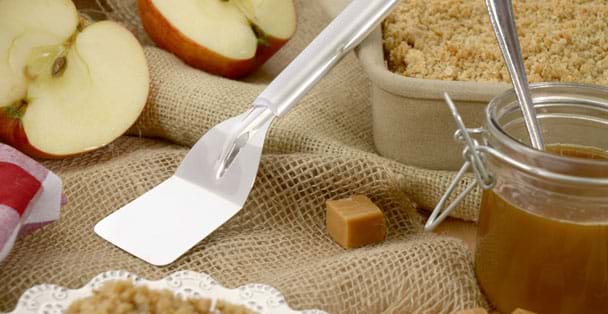 The mini server with a pan of apple cheesecake bar