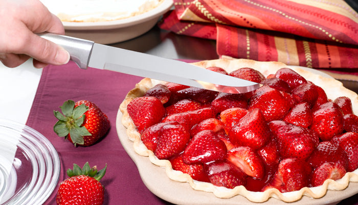 A Slicer knife cuts cherry pie.