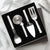 Silver handled Ultimate Utensil Gift Set on a white background with white and silver table decorations